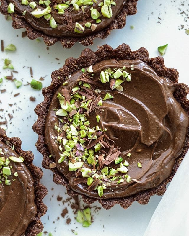 Glass of silky chocolate mousse with cocoa